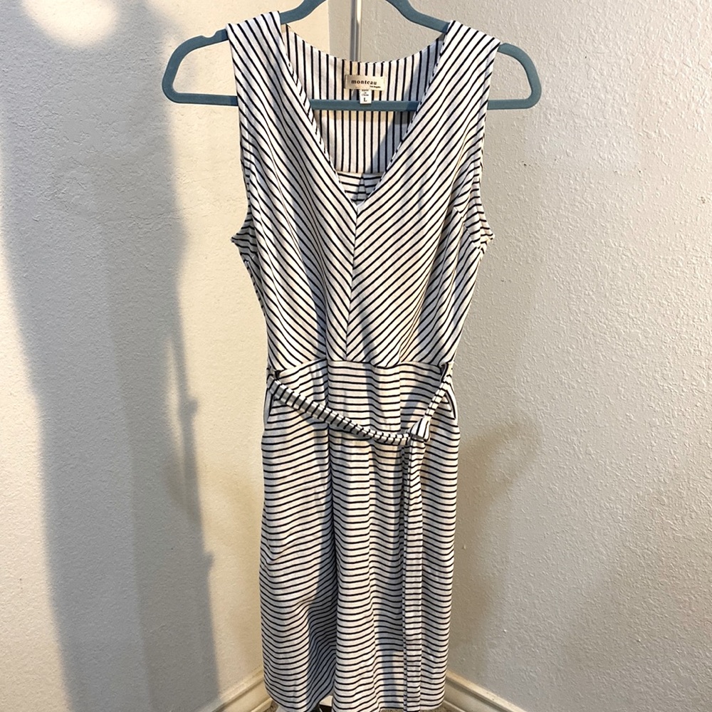 Sleeveless figure flattering linear dress